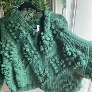Chunky green sweater.